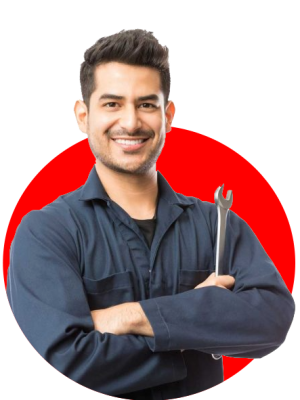 Mechanic smiling while holding a wrench on one hand.